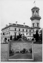 Douglas Baulch holding his painting of  Victorian Government House on the lawns of Government House.